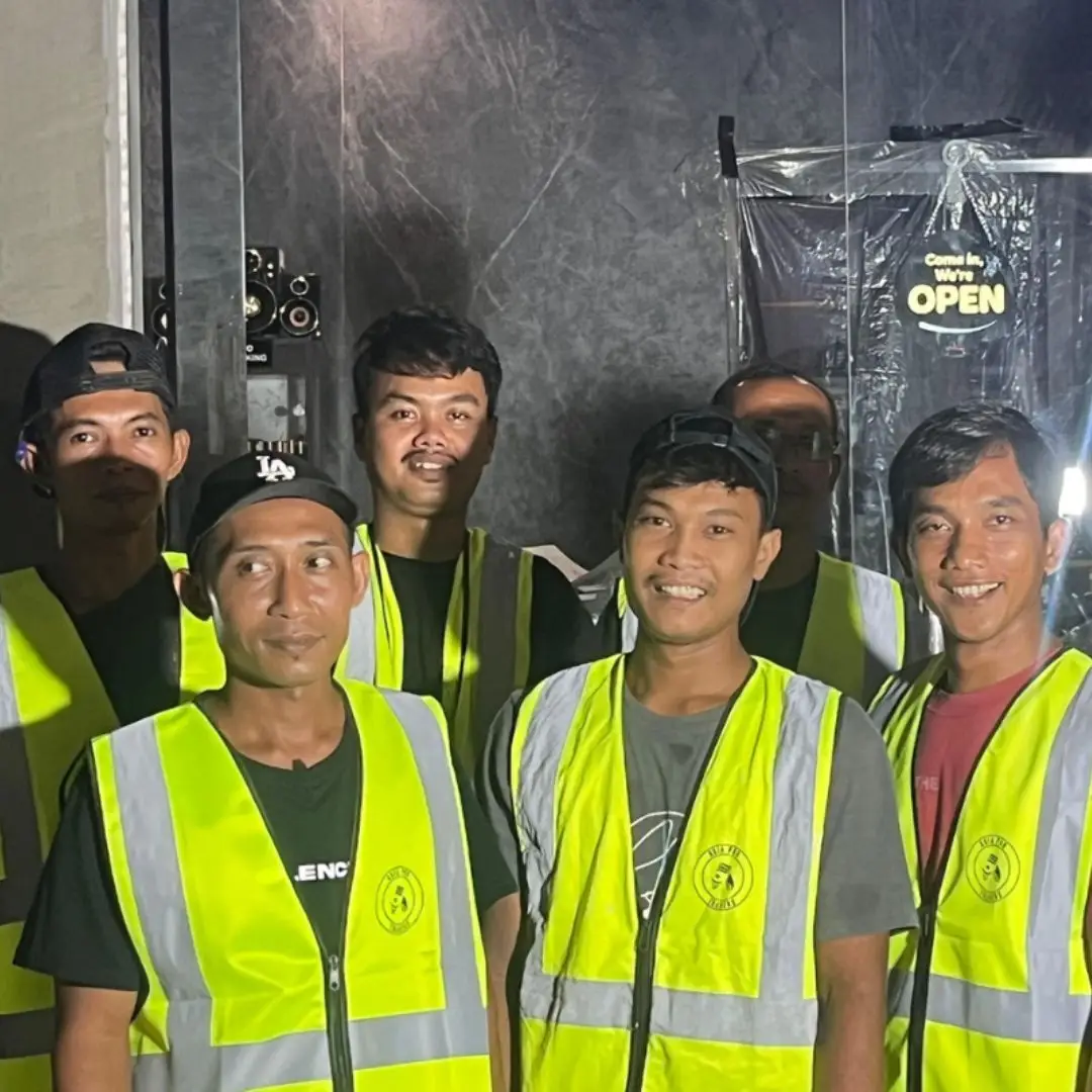 Maintenance coordinator supervising on-site trade work at a Bali villa