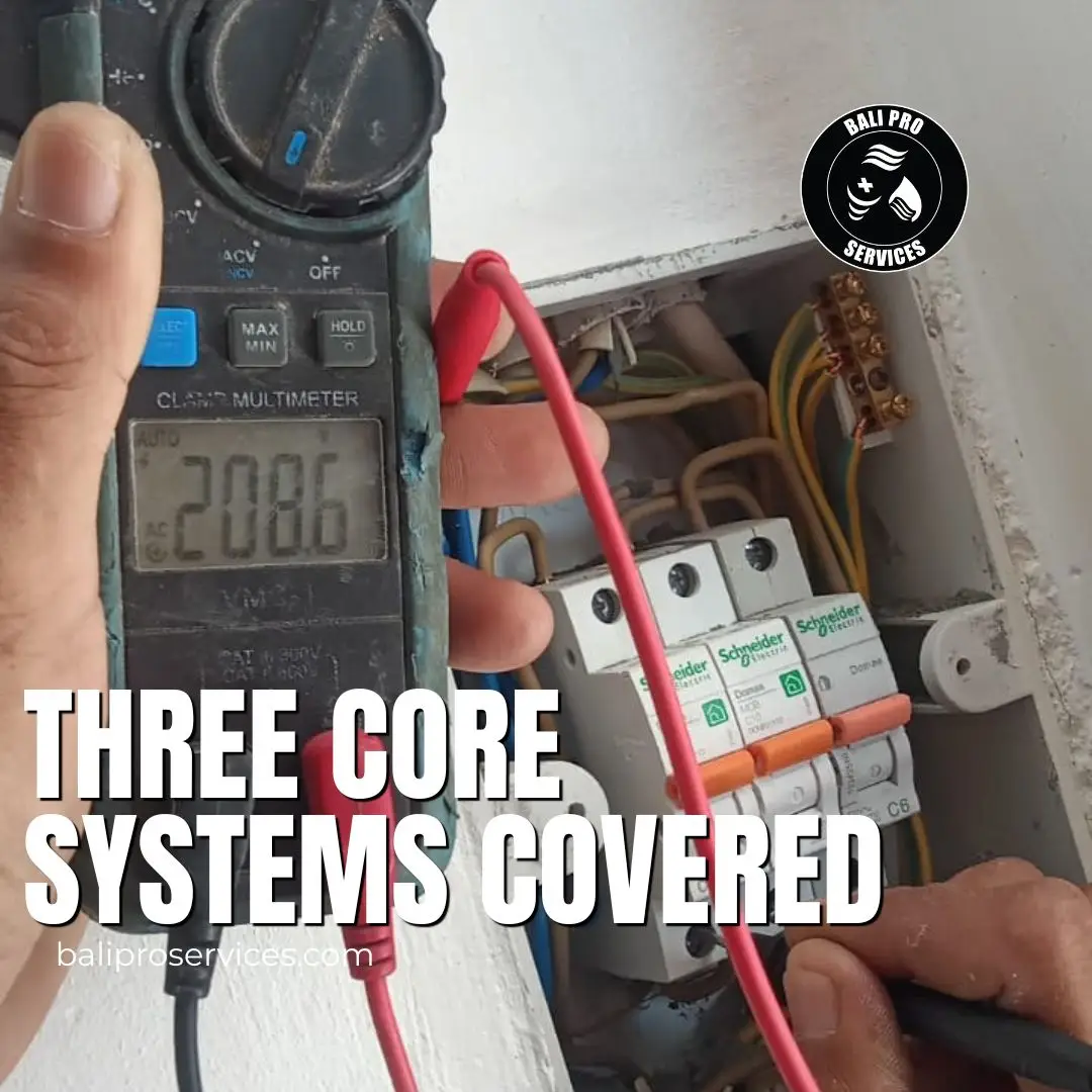 Technician performing preventative maintenance on a villa's AC unit in Bali