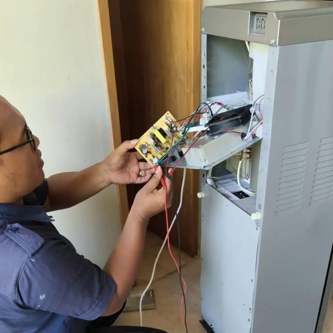 AC servicing and drainage check on a Bali rental property unit